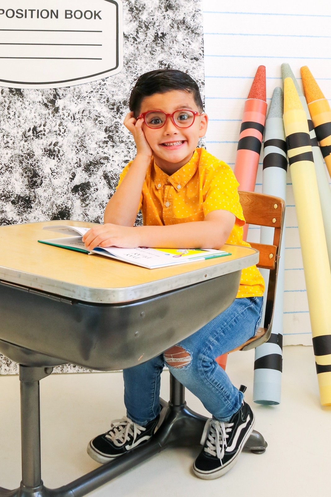School portrait with a classroom desk
